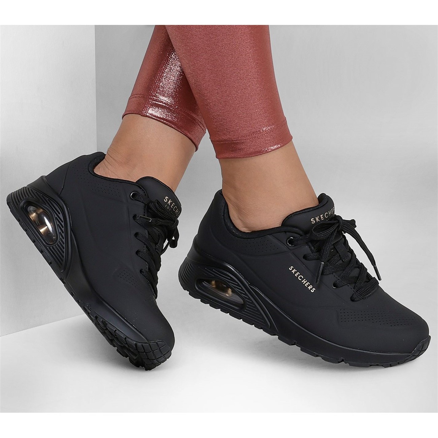 uno skechers black